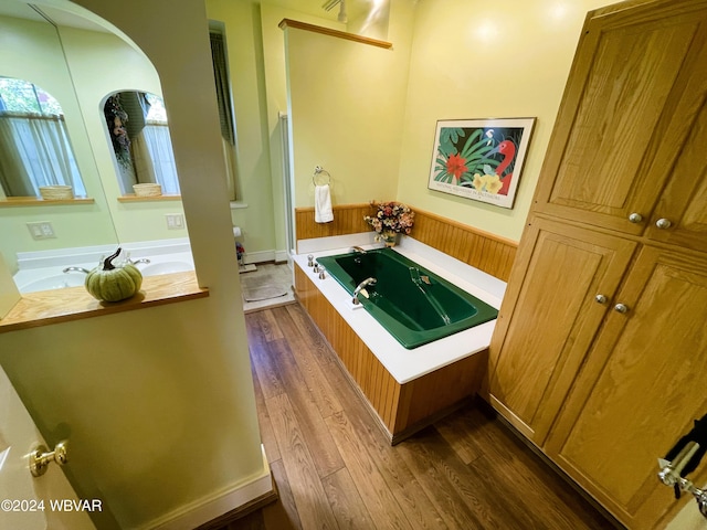 159 Harveys Ln, Milton, PA 17847 - full bathroom with wood finished floors, a wainscoted wall, a jetted tub, and vanity