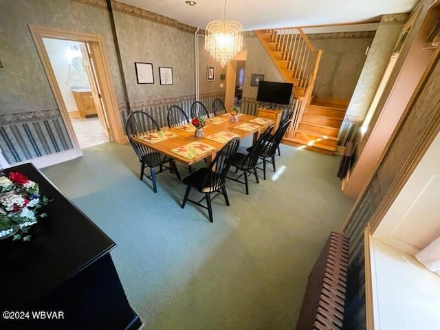 159 Harveys Ln, Milton, PA 17847 - dining space featuring stairway, a chandelier, wallpapered walls, and carpet