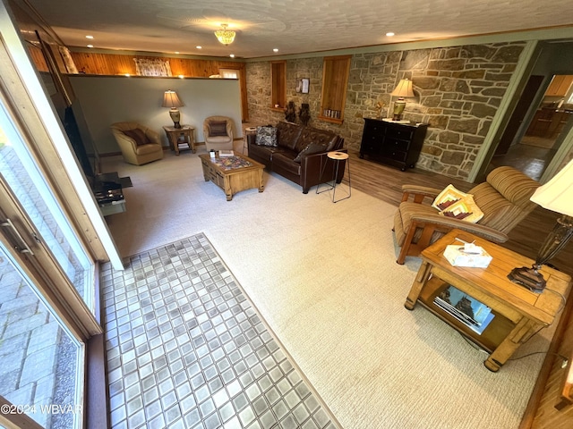 carpeted living room with a textured ceiling