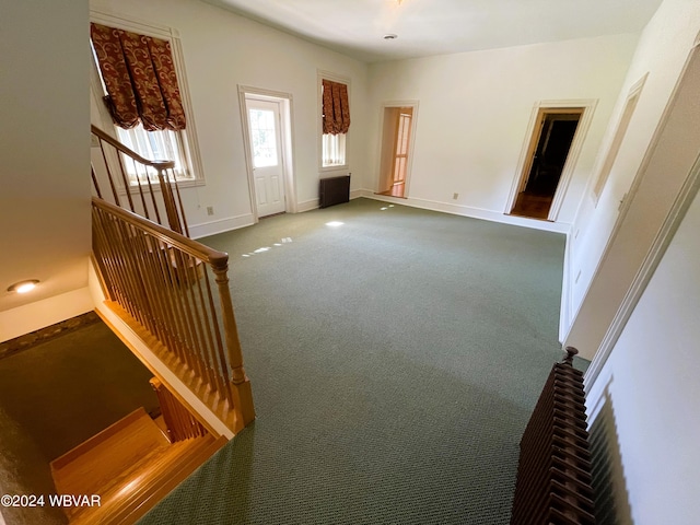 unfurnished living room with carpet floors