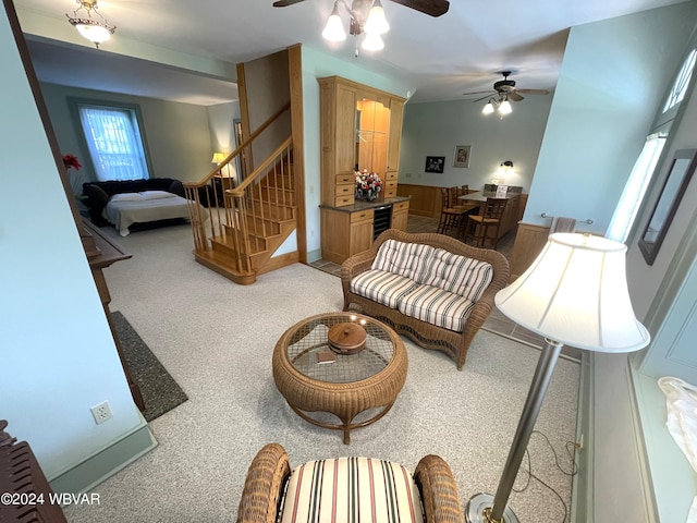 159 Harveys Ln, Milton, PA 17847 - living room featuring ceiling fan, carpet flooring, stairway, and wine cooler