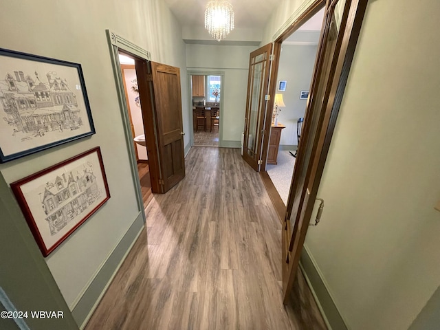 159 Harveys Ln, Milton, PA 17847 - corridor featuring wood finished floors and a chandelier