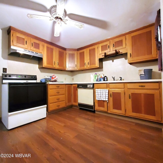 kitchen featuring ceiling fan, dark hardwood / wood-style flooring, white appliances, and sink