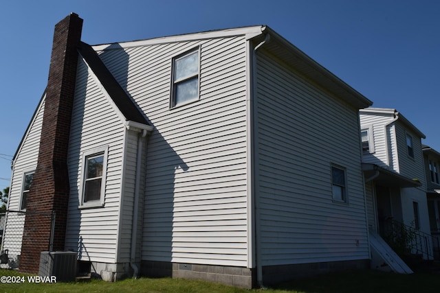 view of property exterior with central AC