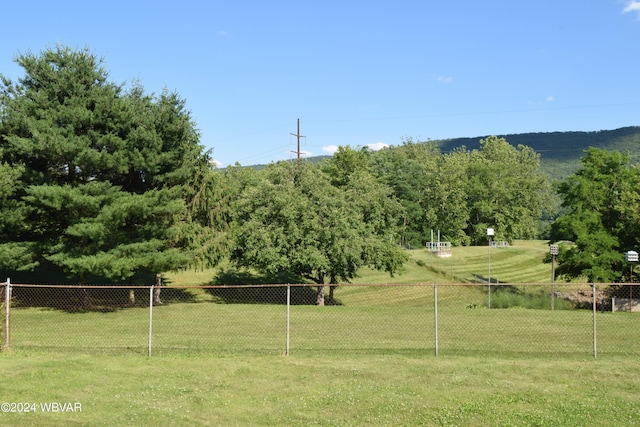 view of property's community with a lawn