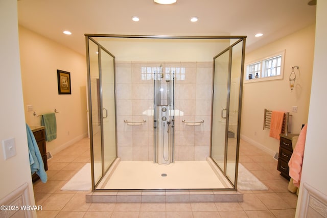 bathroom featuring tile patterned flooring, recessed lighting, and a shower stall