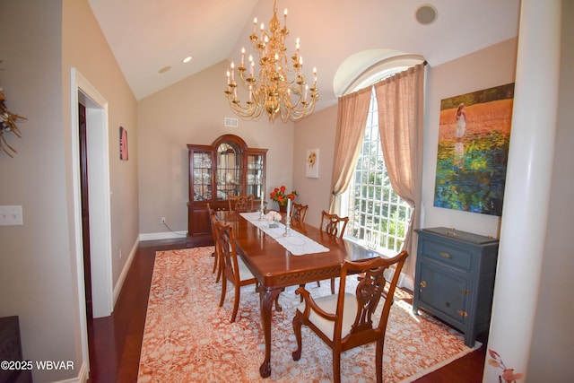 dining area with an inviting chandelier, baseboards, vaulted ceiling, and wood finished floors