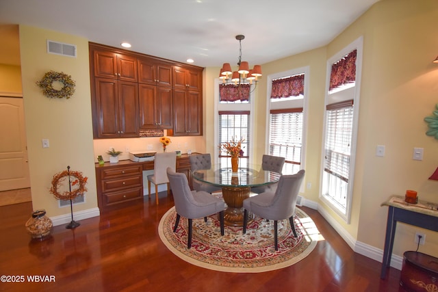 dining area with visible vents, baseboards, recessed lighting, dark wood-type flooring, and an inviting chandelier