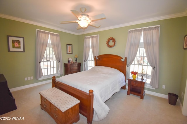 bedroom with baseboards, multiple windows, and light colored carpet