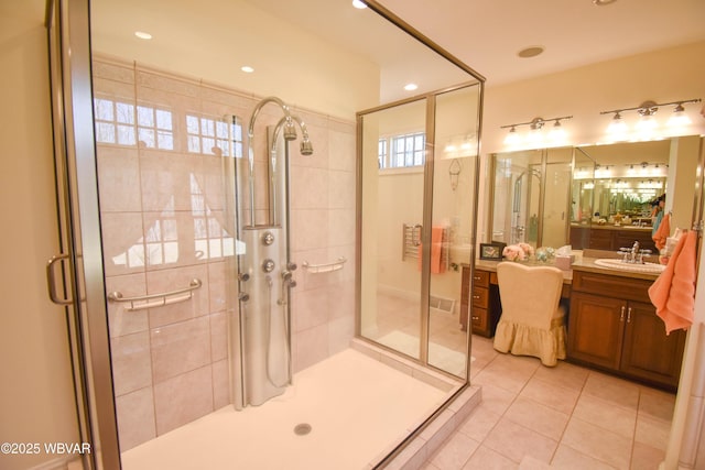 full bath featuring tile patterned floors, vanity, a stall shower, and recessed lighting