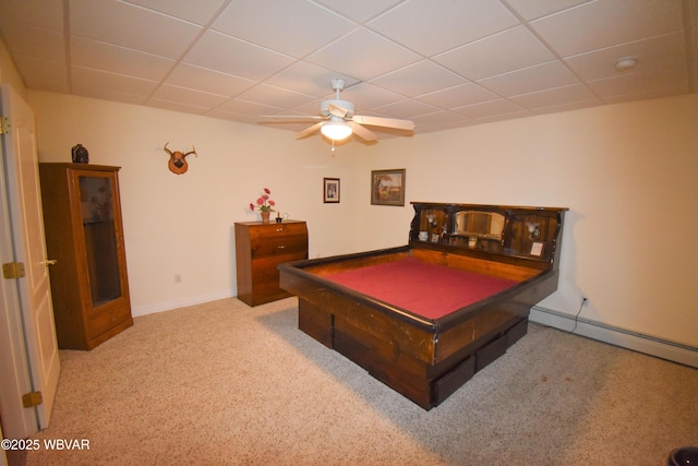 playroom with carpet flooring, a ceiling fan, baseboards, and a drop ceiling