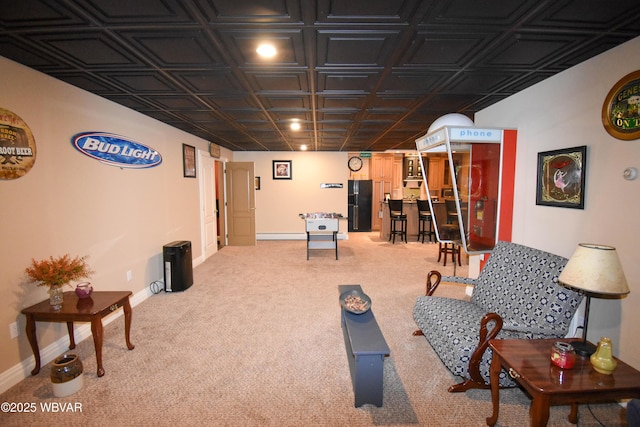 living room featuring a baseboard radiator, light carpet, an ornate ceiling, and baseboards