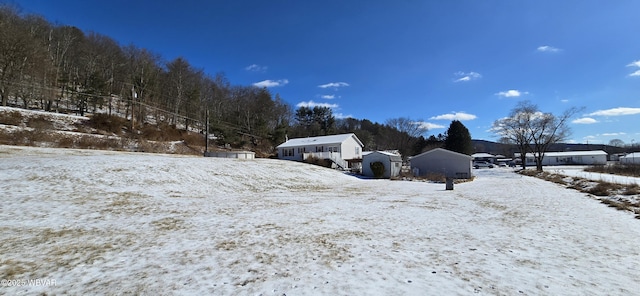 view of yard layered in snow