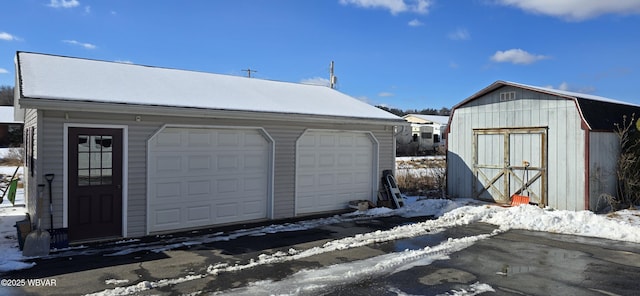 view of snow covered garage