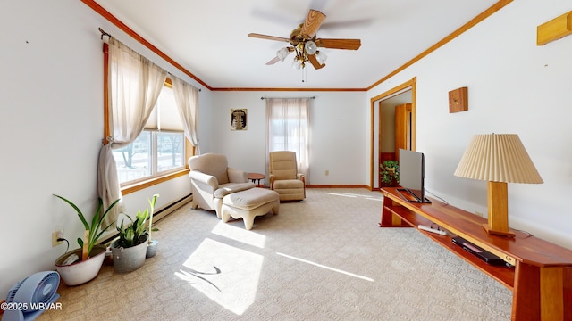 sitting room featuring light carpet, a baseboard heating unit, crown molding, and a wealth of natural light