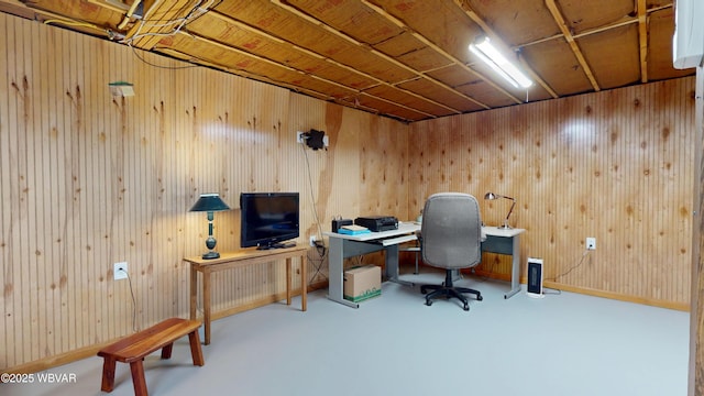 office with concrete floors and wooden walls