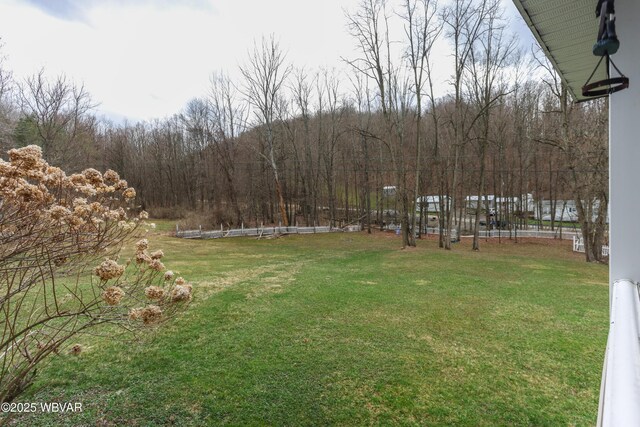 view of yard with a wooded view