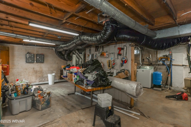 unfinished basement featuring washer / dryer