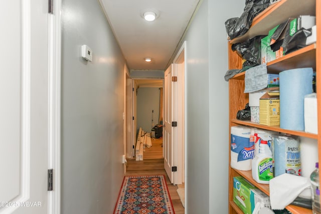 corridor featuring wood finished floors