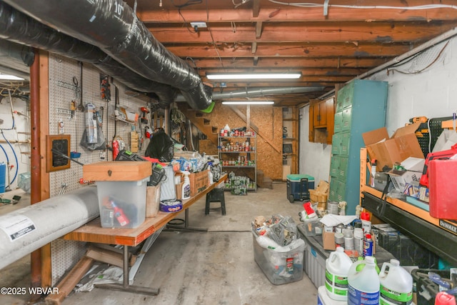 unfinished below grade area featuring a workshop area