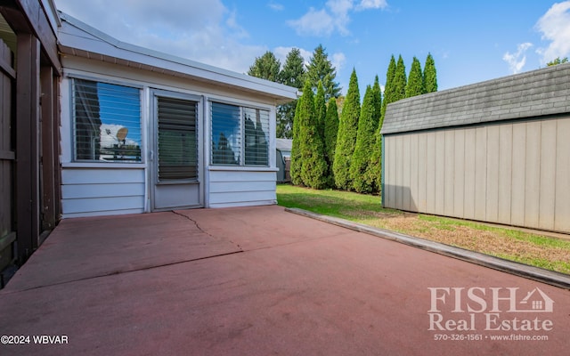 view of patio / terrace with a storage shed