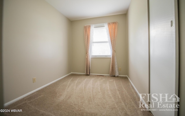 unfurnished room featuring carpet flooring