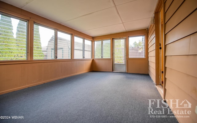 unfurnished sunroom featuring a wealth of natural light