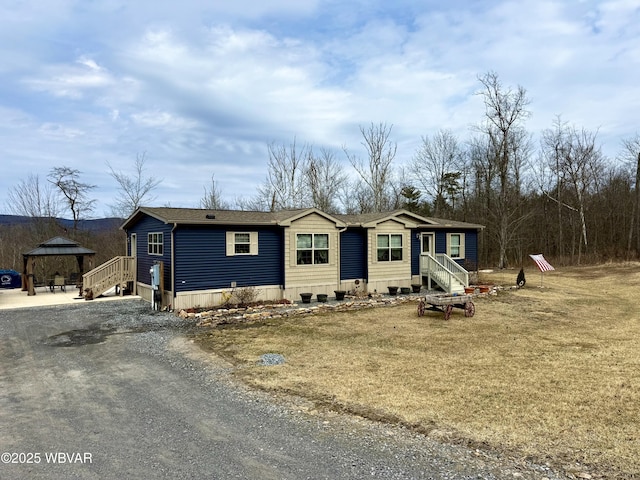 manufactured / mobile home featuring a gazebo and driveway