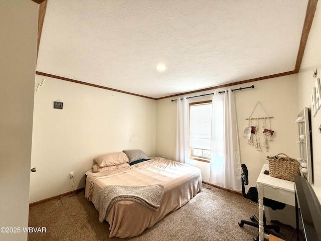 carpeted bedroom featuring a textured ceiling, baseboards, and ornamental molding