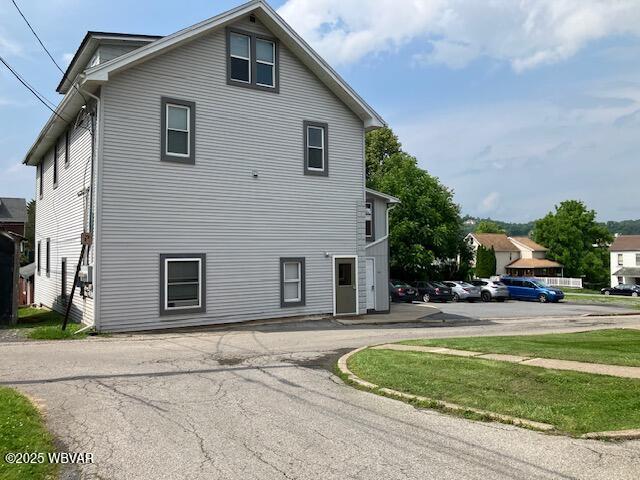 130 N Fairview St, Lock Haven, PA 17745 - view of side of home featuring uncovered parking