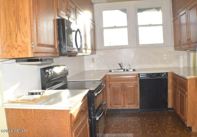 kitchen featuring tasteful backsplash, sink, and black appliances