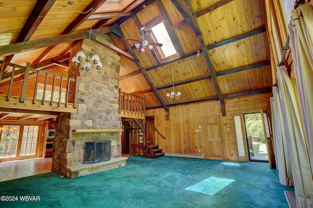 unfurnished living room with a skylight, carpet flooring, and a baseboard radiator