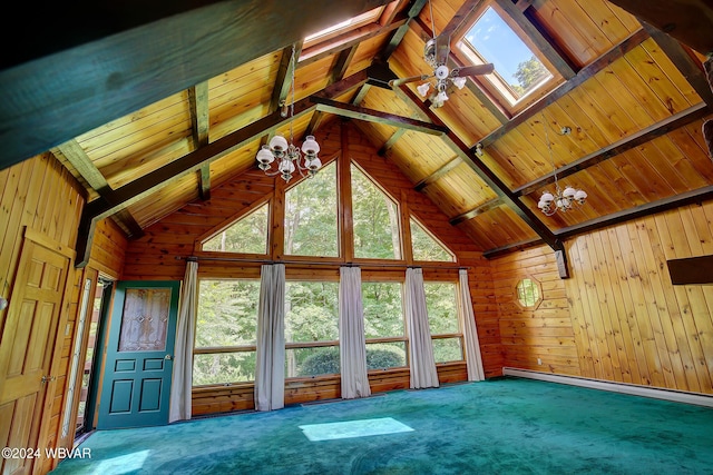 interior space with vaulted ceiling with skylight, wood walls, carpet, and baseboard heating