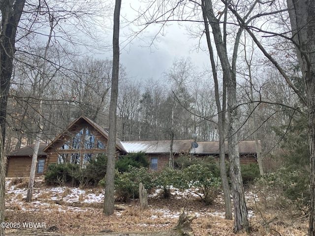 view of front facade with log siding