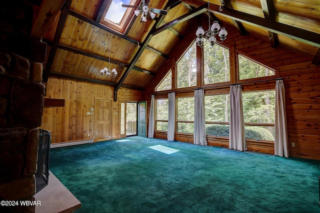 interior space featuring wooden walls, beam ceiling, baseboard heating, and carpet flooring