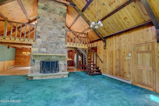 unfurnished living room featuring stairs, a stone fireplace, carpet, and beam ceiling