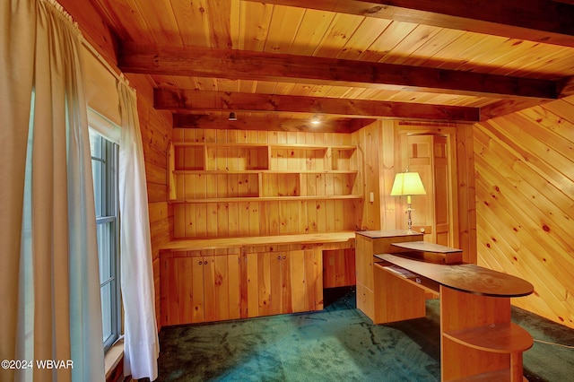 office with wood walls and beam ceiling