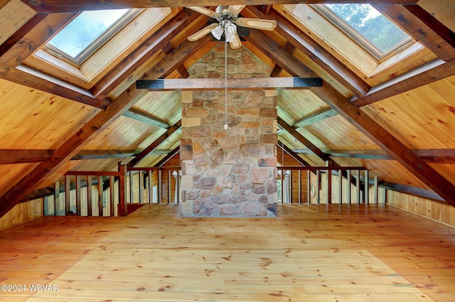 bonus room featuring vaulted ceiling with beams, wooden ceiling, and hardwood / wood-style floors