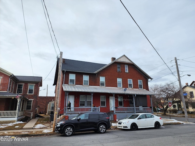 view of property with brick siding