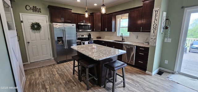 250 Mclaughlin Rd, Milton, PA 17847 - kitchen with stainless steel appliances, a sink, recessed lighting, light wood finished floors, and tasteful backsplash