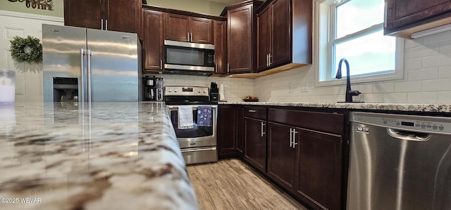 250 Mclaughlin Rd, Milton, PA 17847 - kitchen featuring stainless steel appliances, light stone counters, and tasteful backsplash