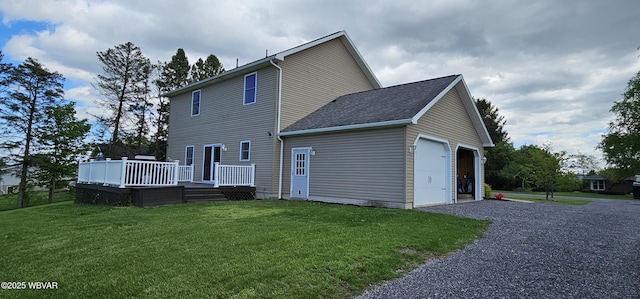 250 Mclaughlin Rd, Milton, PA 17847 - back of house with a deck, an attached garage, driveway, and a yard