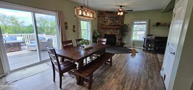 250 Mclaughlin Rd, Milton, PA 17847 - dining room with wood finished floors, ceiling fan, a fireplace, and baseboards