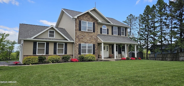 250 Mclaughlin Rd, Milton, PA 17847 - view of front of property with stone siding, a porch, and a shingled roof