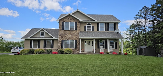 250 Mclaughlin Rd, Milton, PA 17847 - craftsman house with a storage unit, a porch, a front yard, stone siding, and an outdoor structure