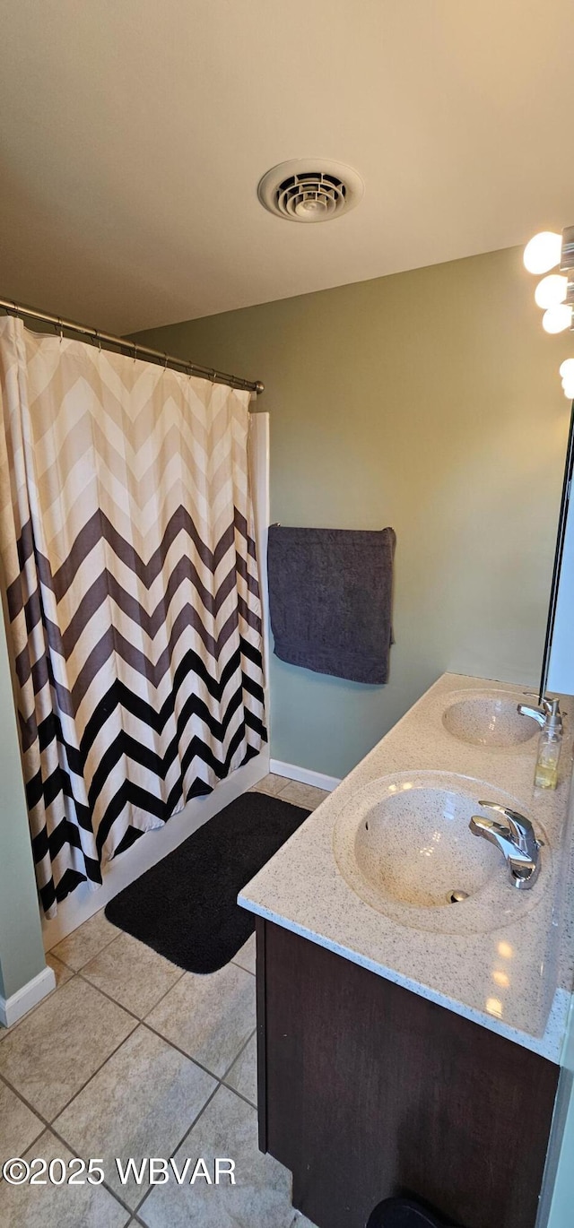 250 Mclaughlin Rd, Milton, PA 17847 - full bathroom featuring tile patterned floors, double vanity, baseboards, and a shower with shower curtain