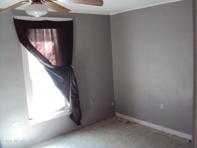 spare room featuring a ceiling fan and light floors