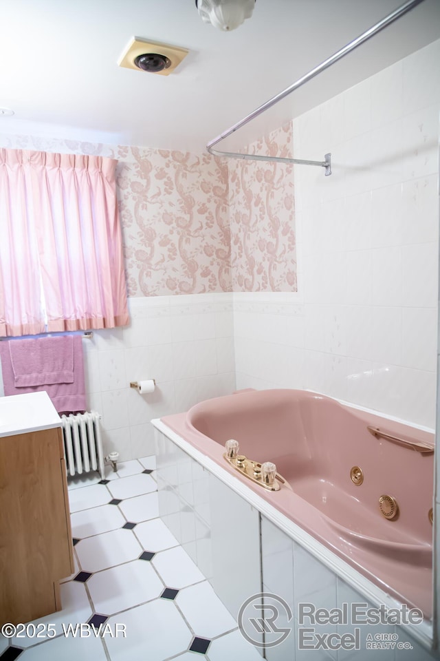 bathroom featuring tiled shower / bath combo, radiator, tile patterned flooring, and tile walls