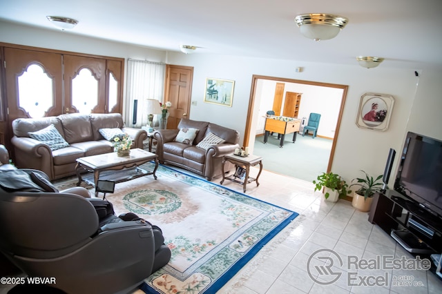 living room with light tile patterned floors