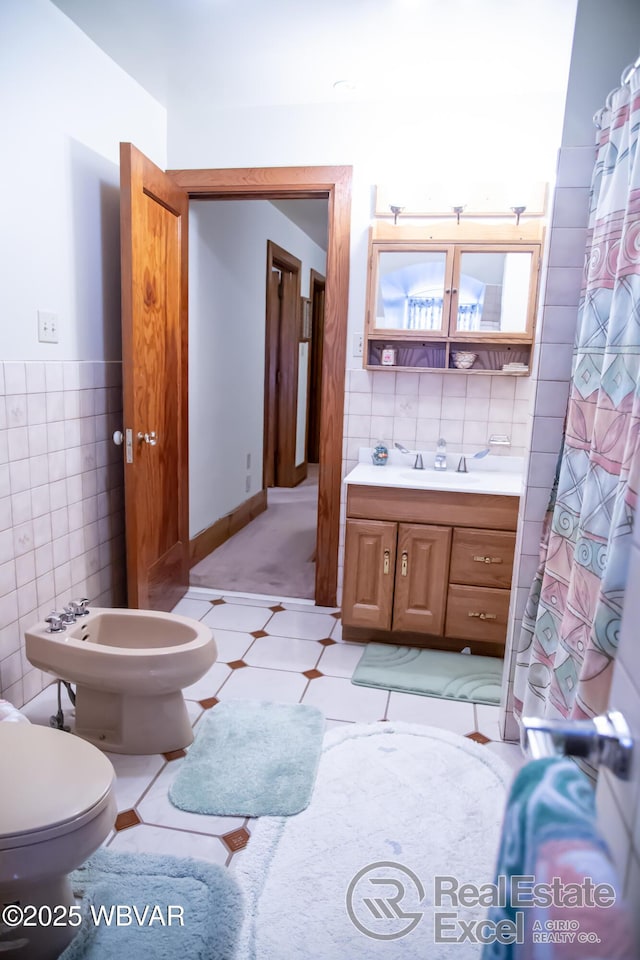 bathroom featuring tile walls, vanity, walk in shower, toilet, and tile patterned floors